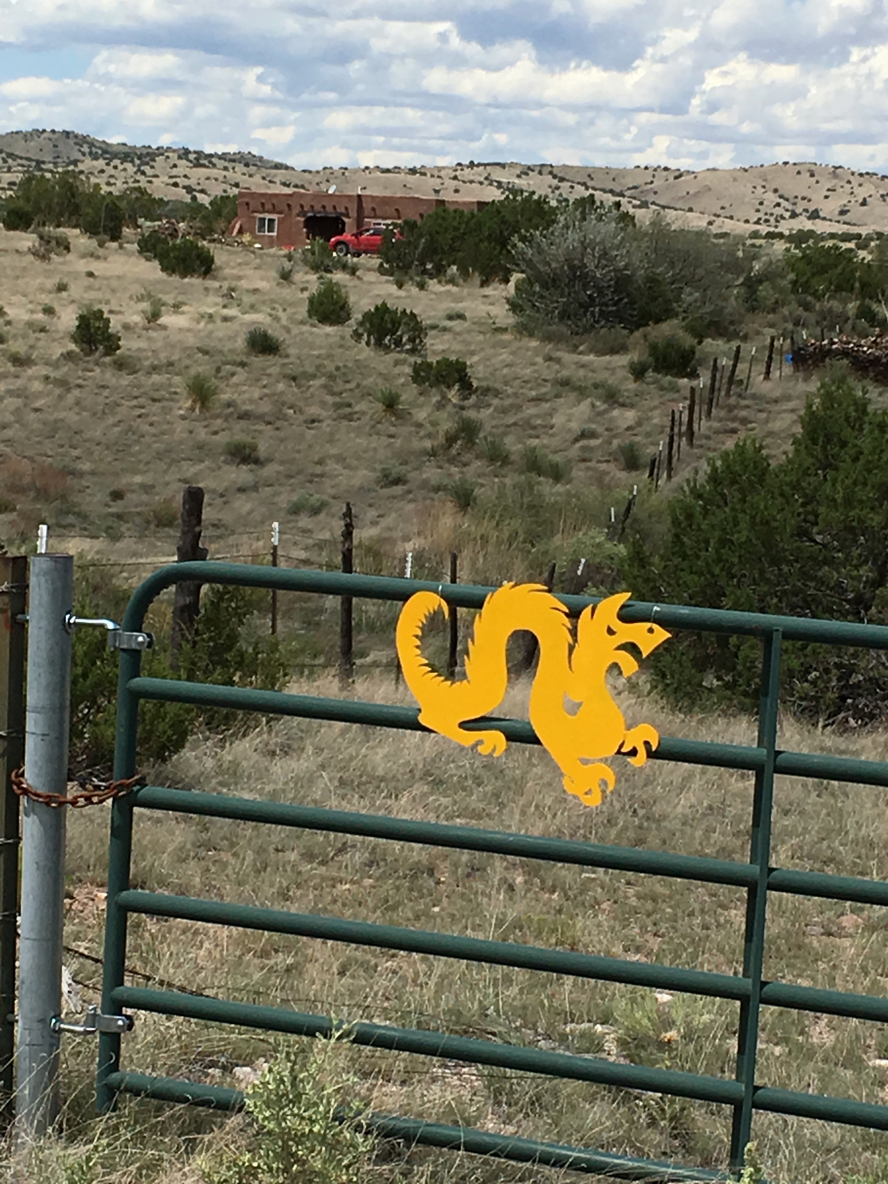 The Drexel Dragon on a fence in rural New Mexico.